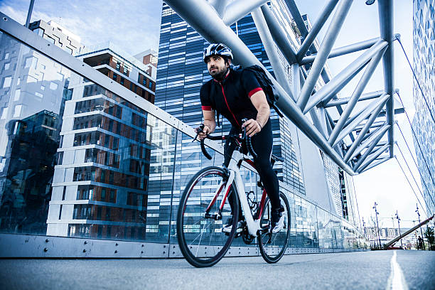 istock Commuter cycling fast at work in the morning 471660720