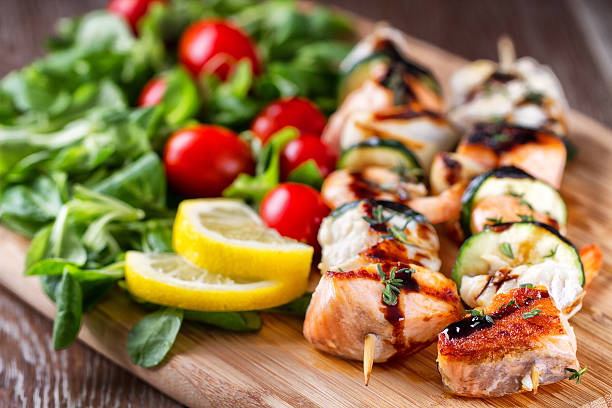 istock Fish skewers with salad 471663659