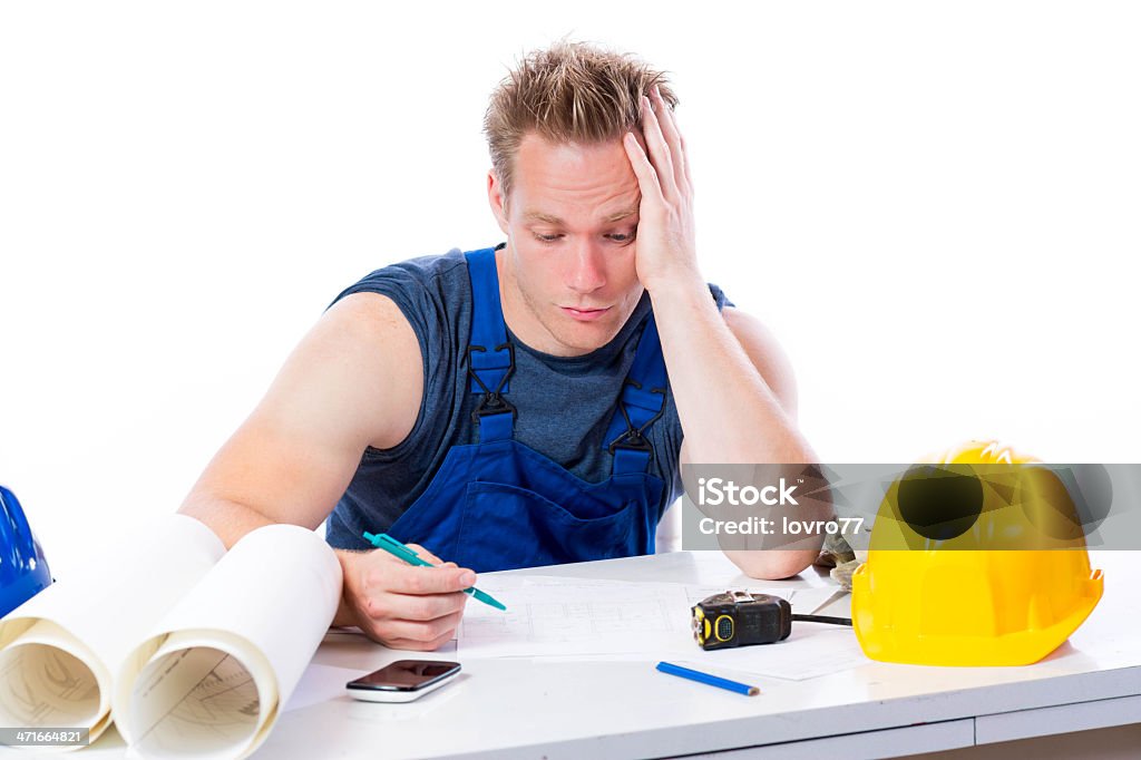 Construction worker looking into the plan. Construction worker looking into the plan. White background. Adult Stock Photo