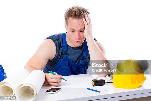 Construction Worker Looking Into The Plan Stock Photo - Download Image Now - Adult, Adults Only, Architecture