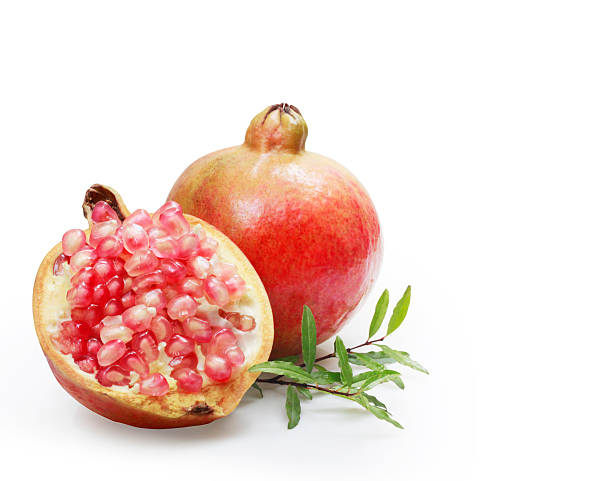 istock Ripe pomegranates with leaves 471665043