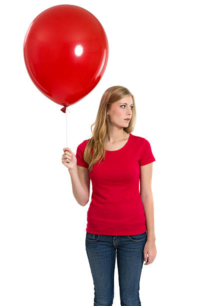 istock Female with blank red shirt and balloon 471665289