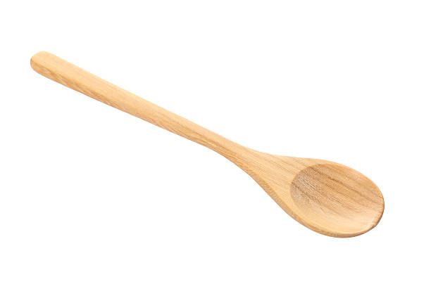 istock wooden spoon isolated over white. 471665864