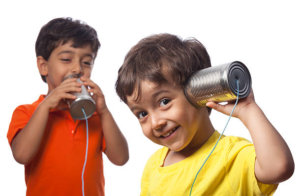 istock Two young boys with tin can phones 471666127