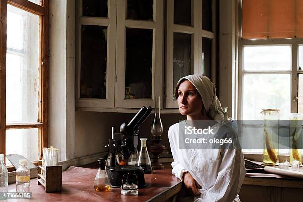 Young Woman In A Biology Laboratory Stock Photo - Download Image Now - Retro Style, Old-fashioned, Laboratory