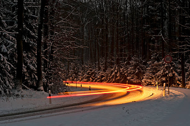 Traffic in a snowy curve.