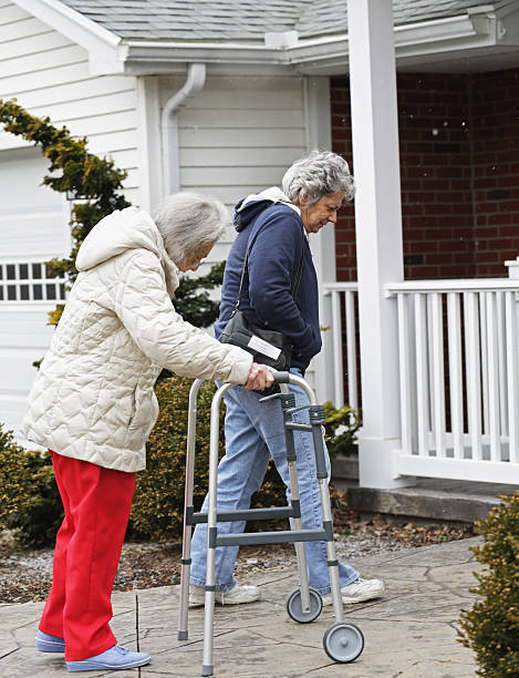 istock Elderly Woman Arriving Home With Daughter 471667553