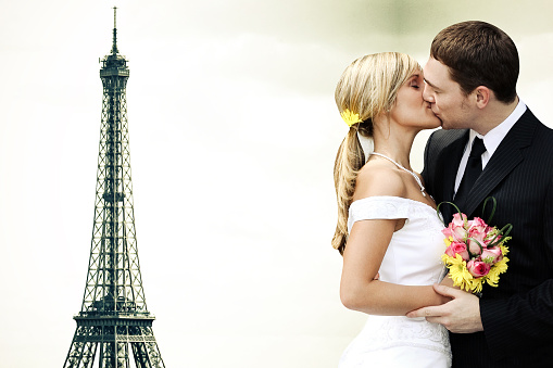 Wedding in Paris. Happy married couple near the Eiffel Tower