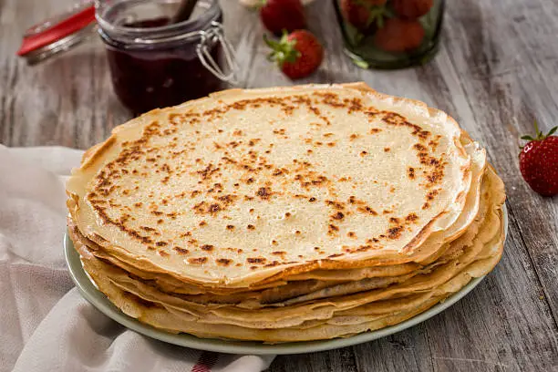 Homemade crepes with strawberry jam