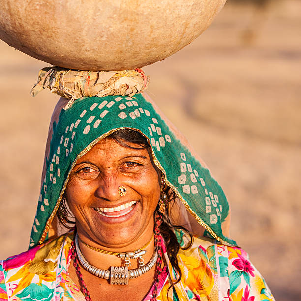 istock Indian woman carrying water, Rajasthan 471669137