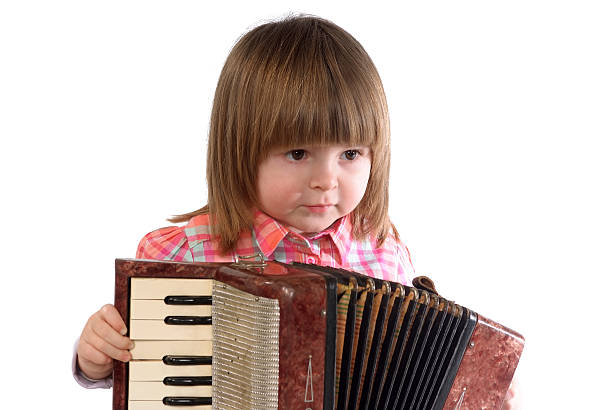 istock Baby and accordion 471669488
