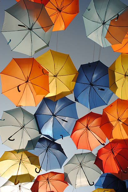 istock Umbrellas in the air 471669810