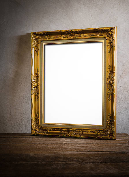 istock A gilt picture frame propped up against a plain wall 471670162