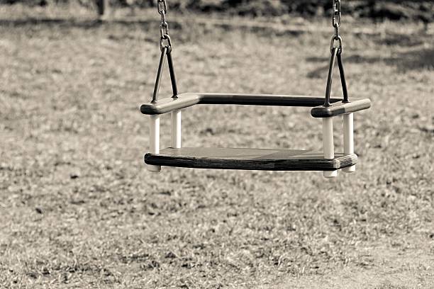 istock children's swing on chains of beige color 471670328
