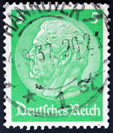 UNITED STATES OF AMERICA - CIRCA 1938: A used postage stamp printed in United States shows a portrait of the President James Monroe on blue background, circa 1938