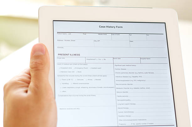 case history form on digital tablet stock photo