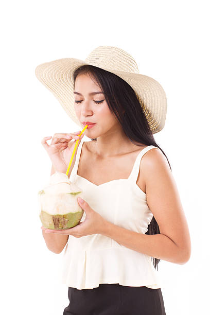 summer woman drinking fresh coconut juice