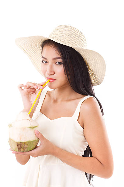 summer woman drinking fresh coconut juice