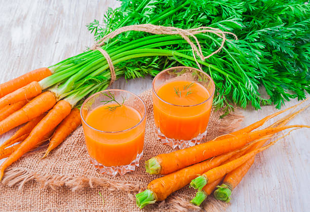istock fresh carrot juice in glasses 471671460