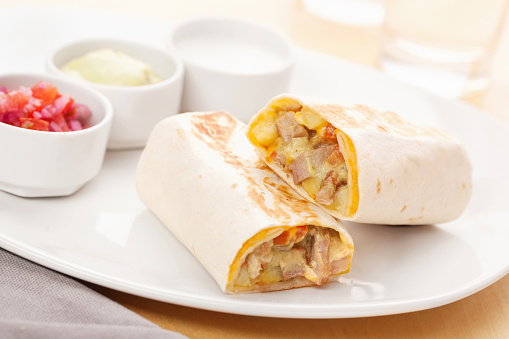 Fresh chicken burrito with salsa and sauces