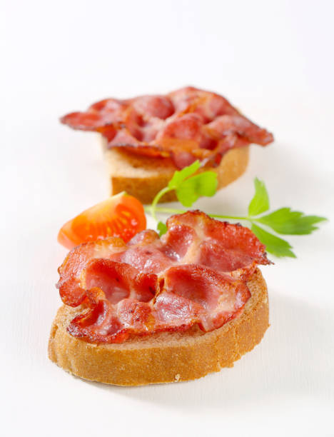 istock Crispy slices of pork meat on bread 471673529