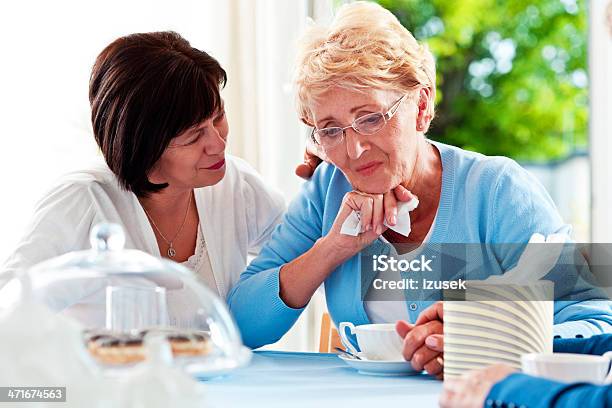 Mature Woman Consoling Her Friend Stock Photo - Download Image Now - Friendship, Mature Women, Sadness