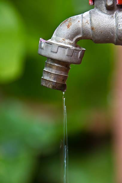 istock Rusty faucet in garden 471675651