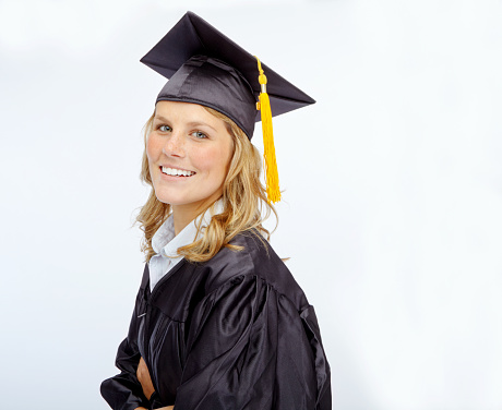 Cap and gown-clad young woman smiling while isolated on whitehttp://195.154.178.81/DATA/i_collage/pu/shoots/784708.jpg