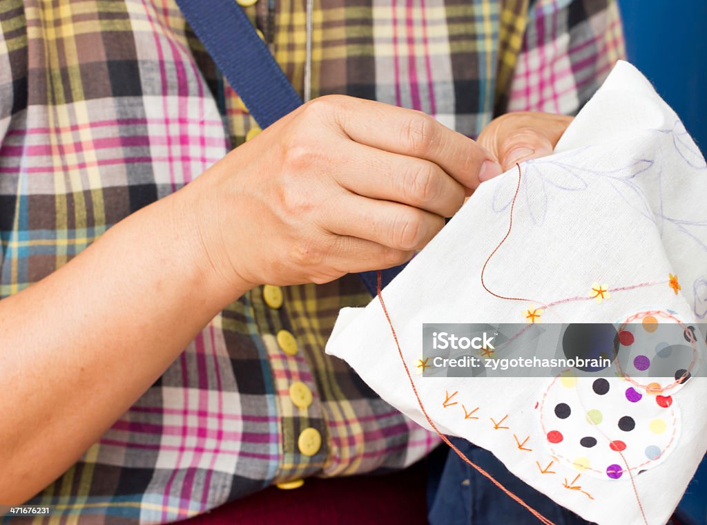 Asian woman's hand sewing. Activity Stock Photo