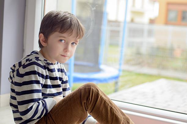 istock Little boy sitting sitting on the floor 471676764