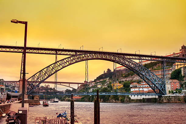 Amazing sunset over Dom Luis Bridge in Porto stock photo