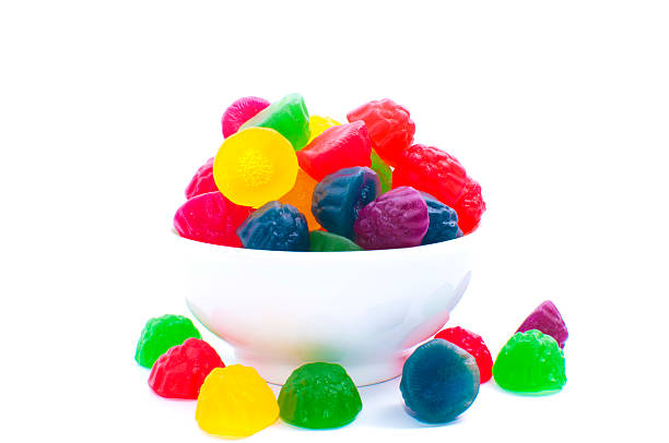 gummy bears candies in a bowl isolated on white background