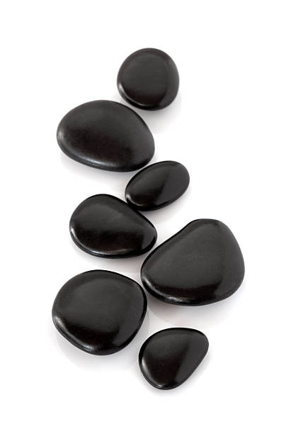 Spa stones Group of black massage stones on white background stone object stock pictures, royalty-free photos & images