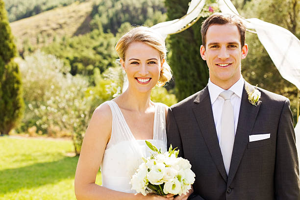 istock Newlywed Couple Standing In Garden 471679661