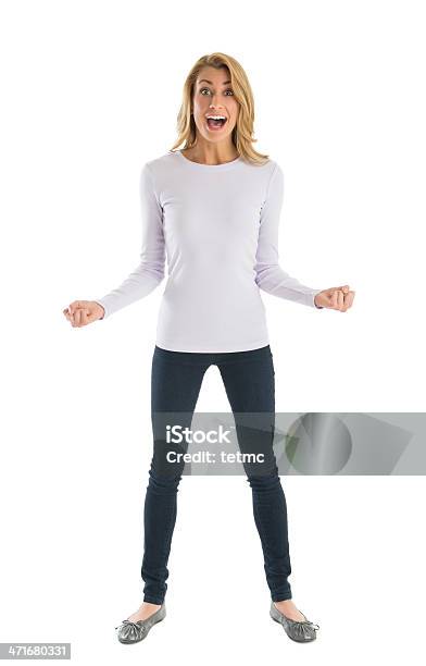 Excited Woman With Clenched Fists Shouting Stock Photo - Download Image Now - Women, Happiness, One Woman Only