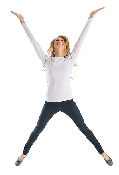 Excited young Caucasian woman jumping isolated on white background