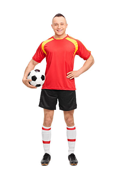istock Young soccer player holding a ball 471680410
