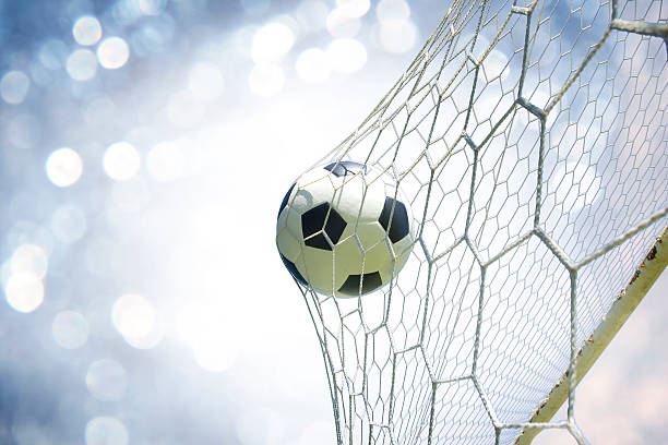 istock soccer ball in goal 471681118