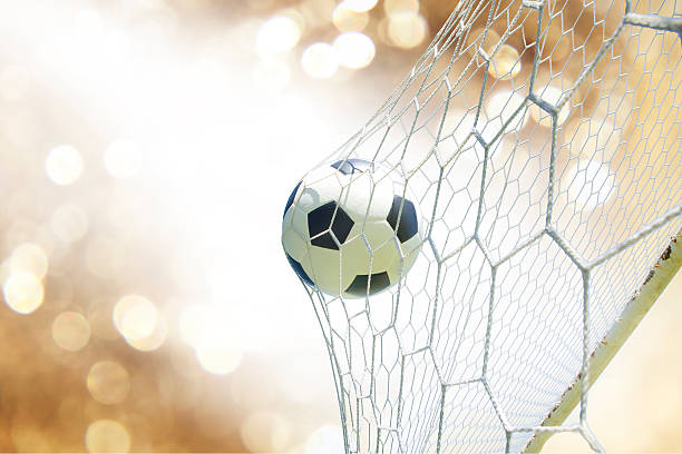 istock soccer ball in goal 471681232