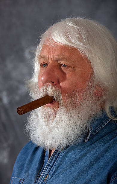 Senior with cigar Cigar - senior with cigar and full beard cuban man smoking big cigar stock pictures, royalty-free photos & images