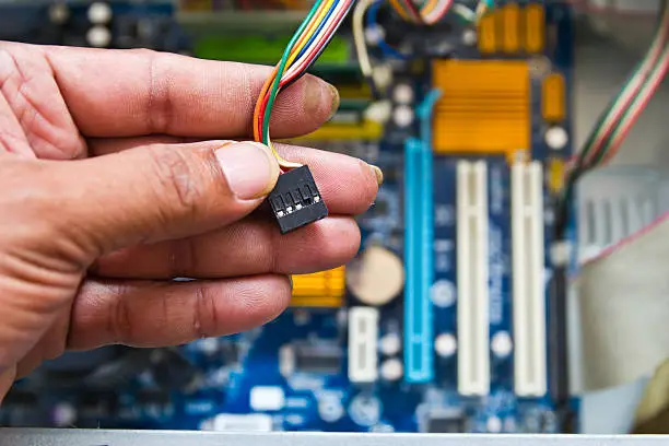 Technician repairing computer hardware in the lab