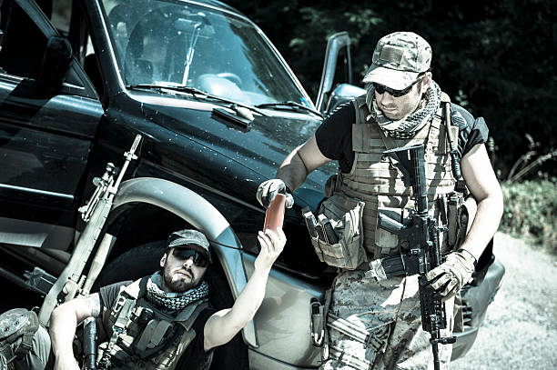 istock Mercenary Contractor Soldiers Drinking at Roadblock Checkpoint 471685157