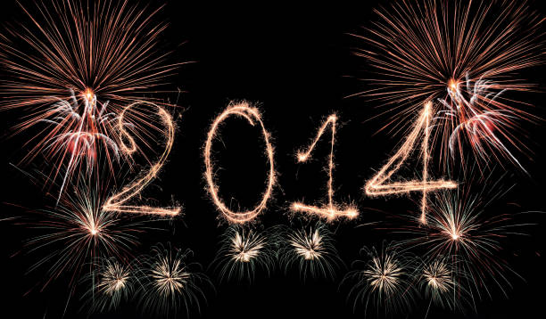 istock The year 2014 sparkling on a black background. 471685997