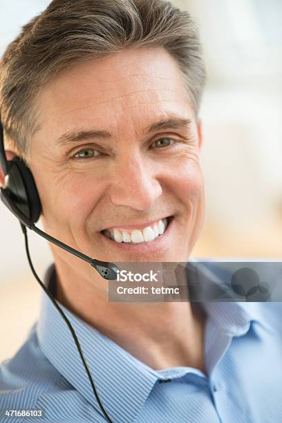 Happy Customer Service Representative Wearing Headset Stock Photo - Download Image Now