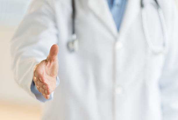 istock Male Doctor Extending His Hand For A Handshake 471686475