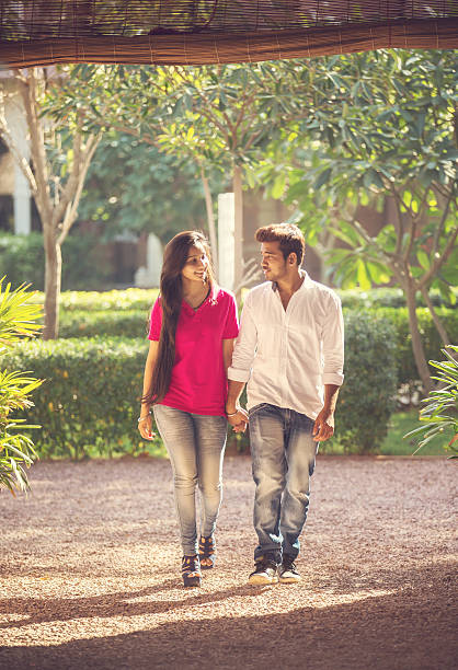 Indian couple Young indian couple walking on the gardens of a hotel in Jodhpur old delhi stock pictures, royalty-free photos & images