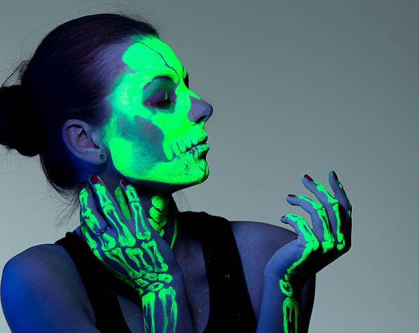 Ultraviolet skeleton girl portrait UV skeleton girl holding palm  body paint stock pictures, royalty-free photos & images