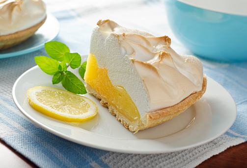 A slice of delicious homemade lemon meringue pie.