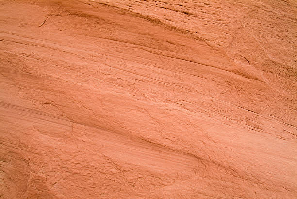 Red Entrada Sandstone Slick Rock Background Southwestern Utah High Desert This background image was photographed in the high desert of southwestern Utah, Kodachrome Basin State Park. Examples of this type of textured rock is seen throughout southern Utah and parts of Arizona. Escalante National Monument and Bryce Canyon National Park are both located in the same area. slickrock trail stock pictures, royalty-free photos & images