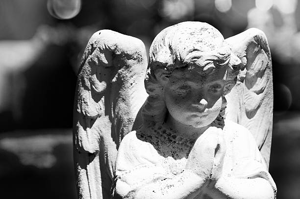 istock Angel head closeup in cemetery 471688485